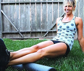 Woman using foam roller